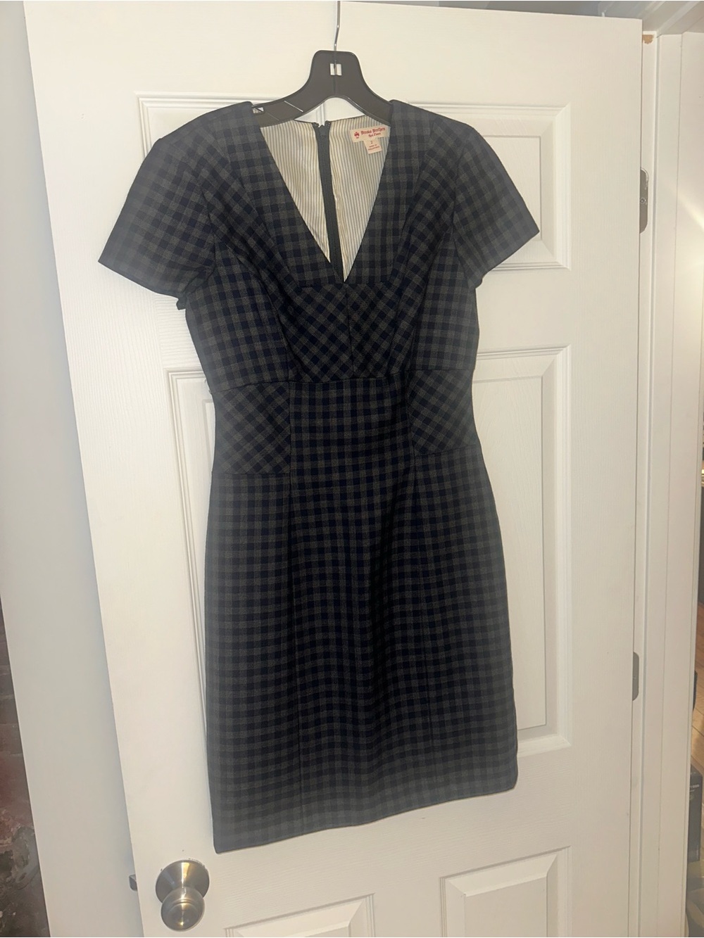 Size 2, Worn only once: 
Brooks Brothers Navy and Black Plaid Fitted Sheath Dres